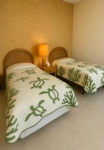 Ένα ή περισσότερα κρεβάτια σε δωμάτιο στο Maalaea Oceanfront Condo