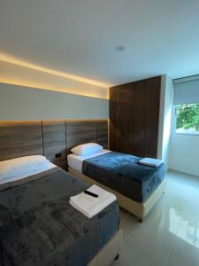 Ένα ή περισσότερα κρεβάτια σε δωμάτιο στο Apto Grand- Ithiel