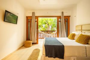 En eller flere senge i et værelse på Perfect Day Home