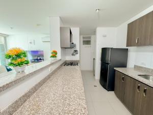 Kuchyň nebo kuchyňský kout v ubytování Acogedores apartamentos en el Rodadero RS By Bedviajes