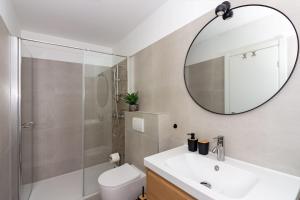 a bathroom with a sink and a mirror at Apartmani Ljubica in Duće +30 photos