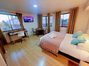 En eller flere senge i et værelse på Aloja Hotel - Frente al Mall Portal Osorno