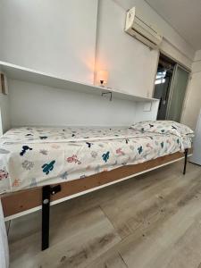 a small bed in a room with a bed frame at Rent Montañeses Nuñez in Buenos Aires +18 photos