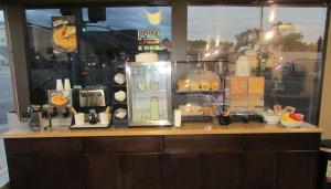 a counter in a restaurant with a coffee shop at Mountain Star Inn Cedar City in Cedar City