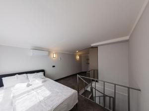 Ένα ή περισσότερα κρεβάτια σε δωμάτιο στο Dorado Suit +18 φωτογραφίες