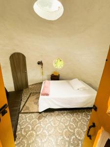 Ένα ή περισσότερα κρεβάτια σε δωμάτιο στο Ananda Glamping Holistico