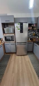 Afbeelding uit fotogalerij van Casa aconchegante com piscina em Nova Tramandai, até 6 hospédes, não aceitamos pets in Tramandaí