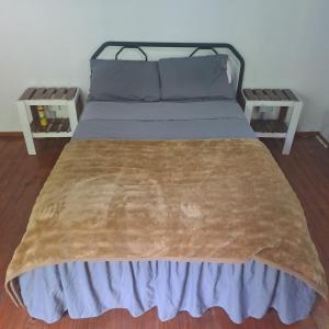 Ένα ή περισσότερα κρεβάτια σε δωμάτιο στο Cabañas eltata