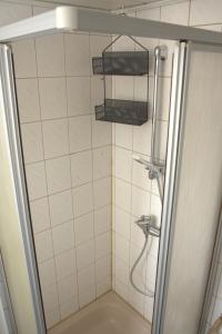 a bathroom with a shower with a sink and a toilet at Bremen-Weyhe - peaceful - kitchen - wifi in Weyhe