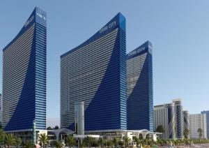 two tall buildings in front of a city at Glorious Sea View Aparthotel in Orbi City Batumi in Batumi