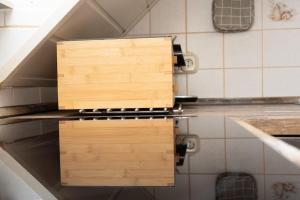 two wooden cutting boards sitting on top of a kitchen counter at Bremen-Weyhe - peaceful - kitchen - wifi in Weyhe