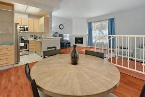 a kitchen with a table with a vase on it at Urban retreat- Quiet comfy 1 bedroom condo near LAX in Los Angeles