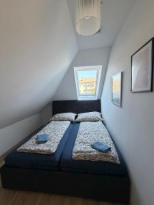 Ένα ή περισσότερα κρεβάτια σε δωμάτιο στο Modernes Zentrales Apartment