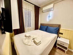 En eller flere senge i et værelse på Taksim Vista Apart + 14 billeder