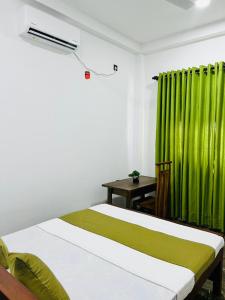 Ένα ή περισσότερα κρεβάτια σε δωμάτιο στο White House River Villa