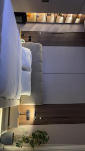 a view of a room with a bed and a couch at استديو ميرا in Abha +8 photos