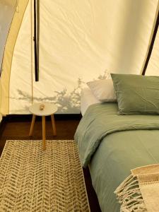 Ένα ή περισσότερα κρεβάτια σε δωμάτιο στο Aldea Zen en Quincho La Mestiza