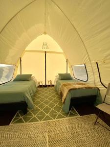 Ένα ή περισσότερα κρεβάτια σε δωμάτιο στο Aldea Zen en Quincho La Mestiza