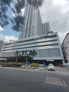 a large building with a samsung sign on it at ASV Condo Staycation SMDC Breeze in Manila
