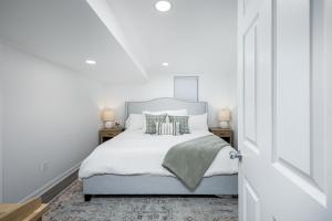 a bedroom with a blue bed with pillows at Main Street Retreat Hot Tub Sleeps 8 in Plymouth