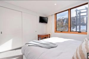 Ένα ή περισσότερα κρεβάτια σε δωμάτιο στο Alpine Gloria - Squatters 17