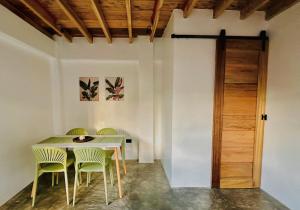 a dining room with a table and chairs at Villa Isleñas - Solar, Starlink, Pool in General Luna +15 photos