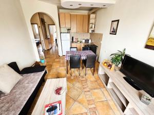 a living room with a couch and a table at Mother Teresa Apartments in Skopje