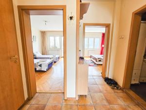 a view of a living room from the hallway at Mother Teresa Apartments in Skopje