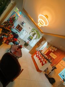 an aerial view of a living room with a christmas tree at Mi Quinta Raíz Loft Apartments in Iquitos