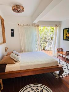 Postel nebo postele na pokoji v ubytování VILLA SAMAE - Vue Océan, Piscine, Jacuzzi & Charme Tropical à La Réunion + 11 fotografií