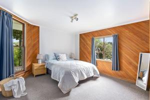 Ένα ή περισσότερα κρεβάτια σε δωμάτιο στο Langley Lodge