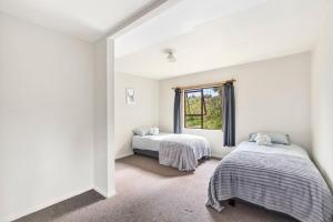 Ένα ή περισσότερα κρεβάτια σε δωμάτιο στο Langley Lodge