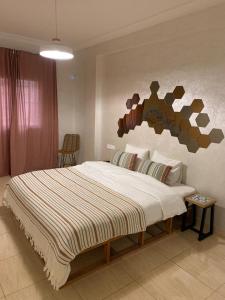 Ένα ή περισσότερα κρεβάτια σε δωμάτιο στο Massira Social Living - Locanda Collective