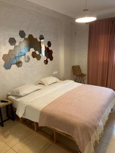 Ένα ή περισσότερα κρεβάτια σε δωμάτιο στο Massira Social Living - Locanda Collective