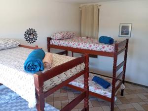 En eller flere senge i et værelse på Vista Montanha Sagrada