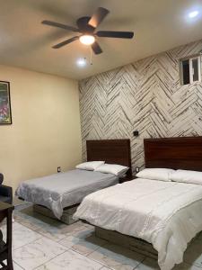 Giường trong phòng chung tại Terraza Peñasco