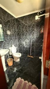 Ένα μπάνιο στο Suítes Santa Luzia