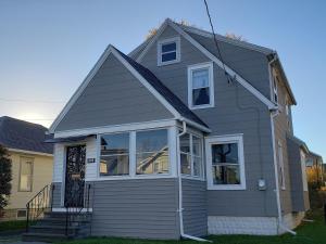 a gray house with a front door and windows at Grand Central - Pet friendly 3 BR 2 Bath in Johnson City