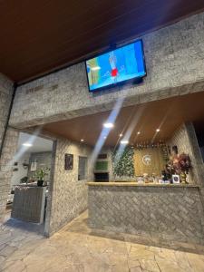 Μια τηλεόραση ή/και κέντρο ψυχαγωγίας στο Suite Lilo e Stitch - Pousada Castelo do Luar