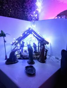 a table with a group of figurines on it at Ursus, Mi casita en México in Mexico City