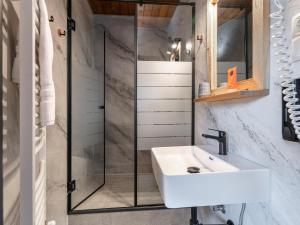 a bathroom with a sink and a shower at Bergzeit Hollersbach XL in Hollersbach im Pinzgau +32 photos