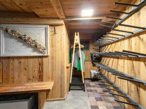 a hallway with wooden walls and stairs in a building at Bergzeit Hollersbach XL in Hollersbach im Pinzgau