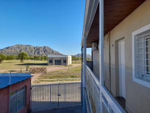 a balcony of a house with a view of a mountain at Depto La Punta in La Punta