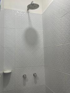 a bathroom with a shower with a shower head at Casa Santa Rosa Garden in Santa Rosa de Cabal +12 photos