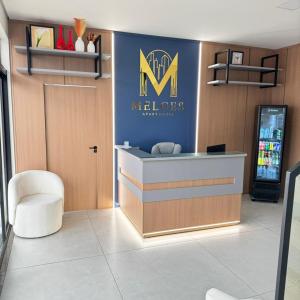 a meelars store with a sign on the wall at Melges Apart Hotel in Pontes e Lacerda