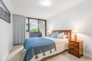 Ένα ή περισσότερα κρεβάτια σε δωμάτιο στο Holiday in style at Flightdeck Port Macquarie