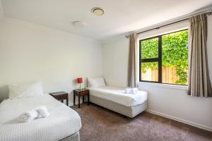 Ένα ή περισσότερα κρεβάτια σε δωμάτιο στο Pembroke Villa