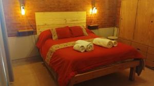 En eller flere senge i et værelse på Anlupa Casa