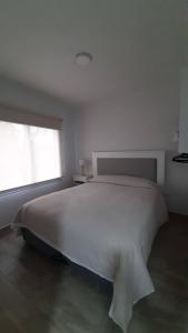 Кровать или кровати в номере El Estudio Céntrico con cochera