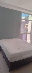 En eller flere senge i et værelse på Pousada Horbis